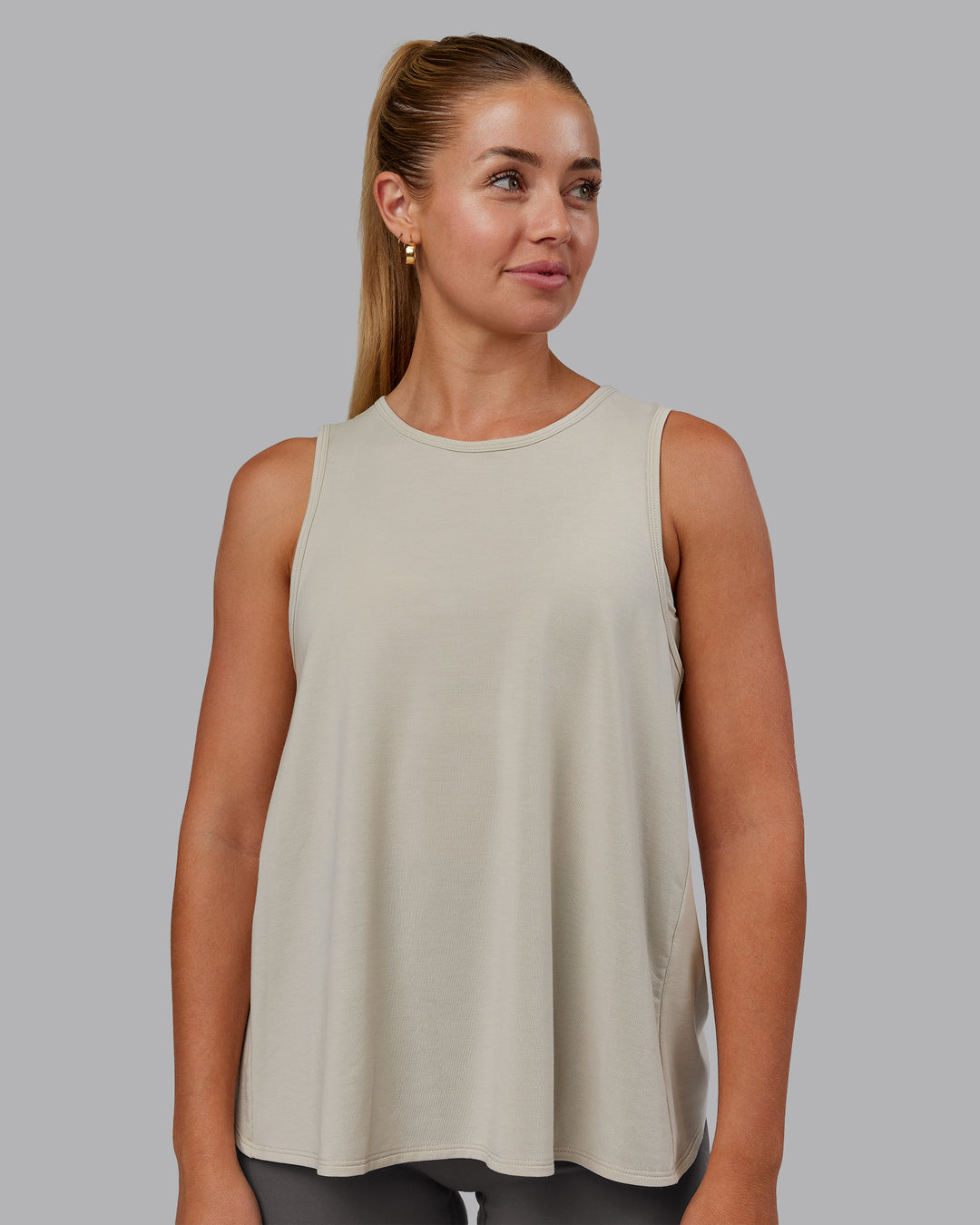 Woman wearing Breeze Training Tank - Shale Beige | Model:Hannah | Size:S