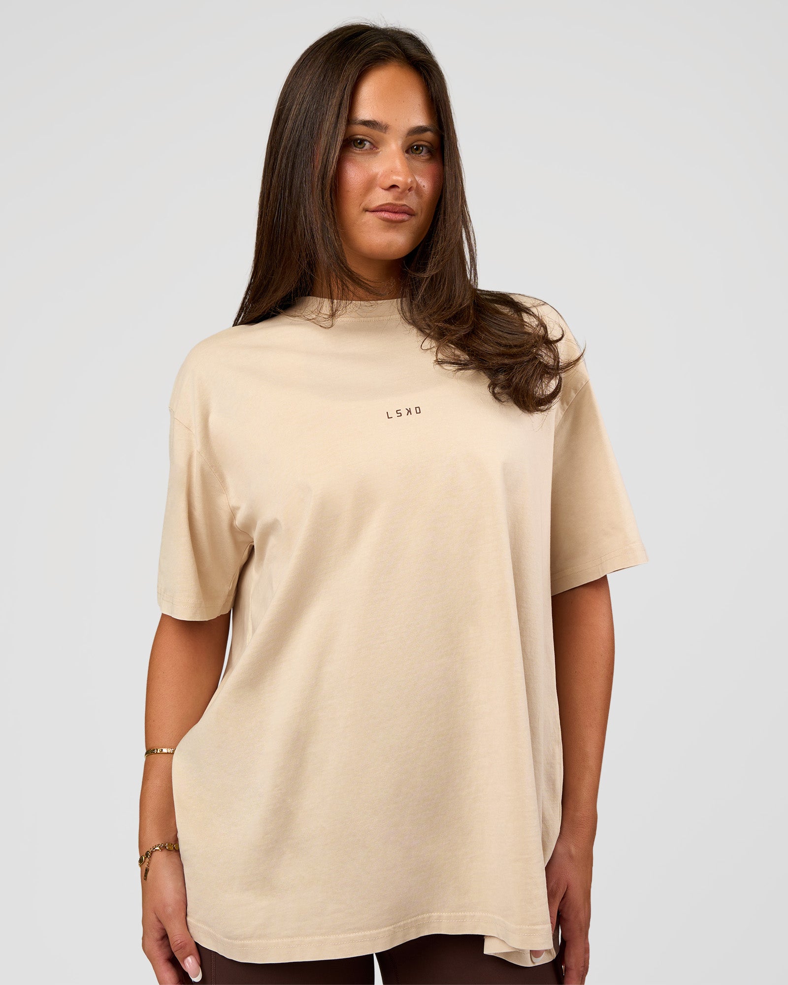 Woman wearing Built On Values Oversized Washed Tee - Shale Beige Washed-Hot Chocolate | Model:Bianca | Size:S