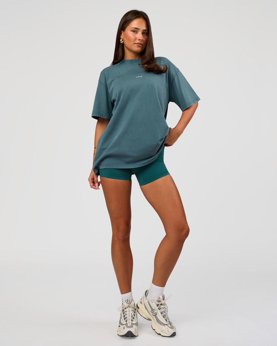 Woman wearing Built On Values Oversized Washed Tee - Transformative Teal Washed-White | Model:Bianca | Size:S