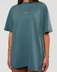 Woman wearing Built On Values Oversized Washed Tee - Transformative Teal Washed-White | Model:Bianca | Size:S