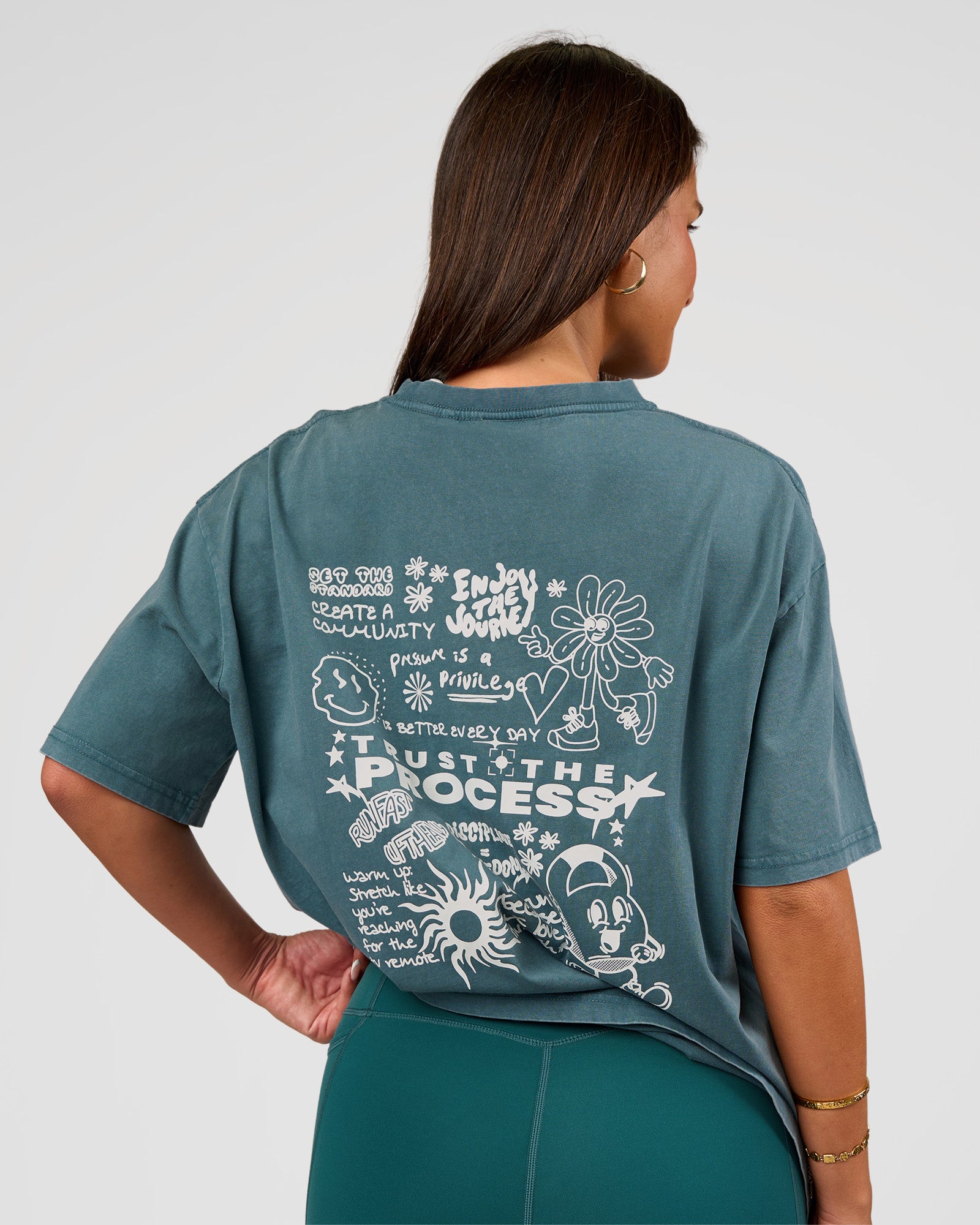 Woman wearing Built On Values Oversized Washed Tee - Transformative Teal Washed-White | Model:Bianca | Size:S
