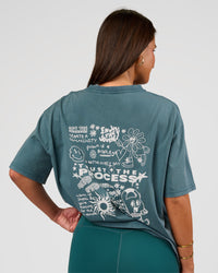 Woman wearing Built On Values Oversized Washed Tee - Transformative Teal Washed-White | Model:Bianca | Size:S