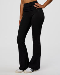 Woman wearing CF Fold Over High-Rise Flared Legging - Black | Model:Jordan | Size:S