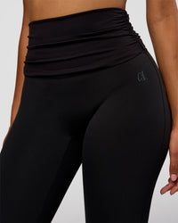 Woman wearing CF Fold Over High-Rise Flared Legging - Black | Model:Jordan | Size:S