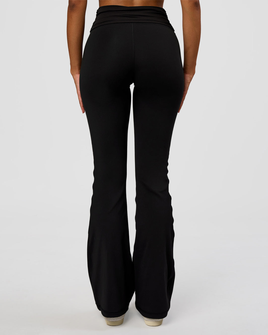 Woman wearing CF Fold Over High-Rise Flared Legging - Black | Model:Jordan | Size:S