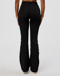Woman wearing CF Fold Over High-Rise Flared Legging - Black | Model:Jordan | Size:S