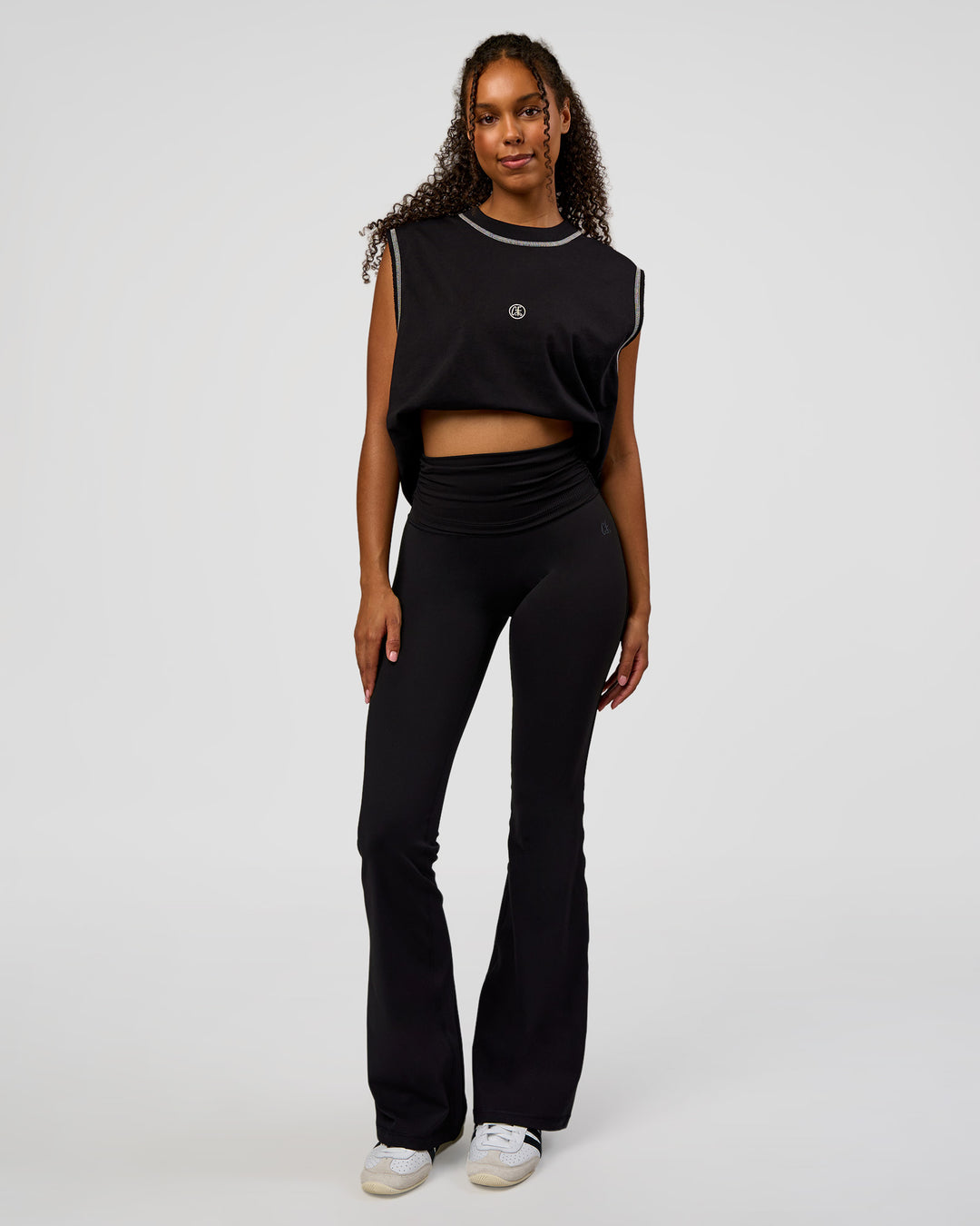 Woman wearing CF Fold Over High-Rise Flared Legging - Black | Model:Jordan | Size:S