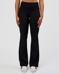 Woman wearing CF Fold Over High-Rise Flared Legging Tall - Black | Model:Rosie | Size:S
