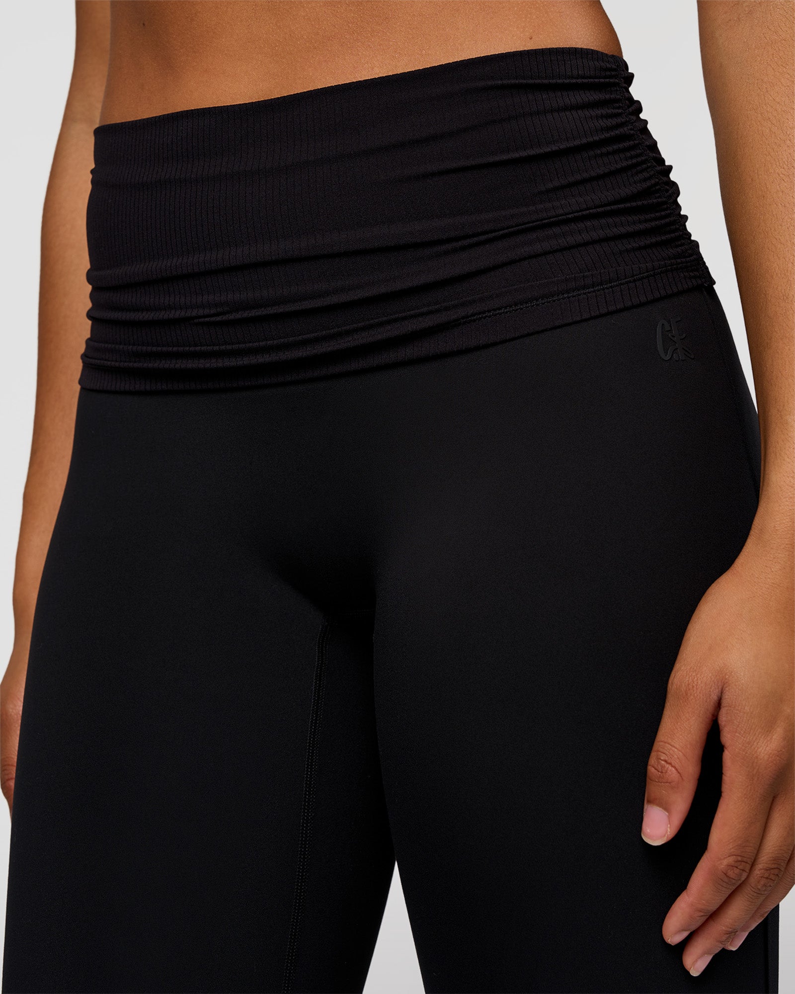 Woman wearing CF Fold Over High-Rise Flared Legging Tall - Black | Model:Rosie | Size:S