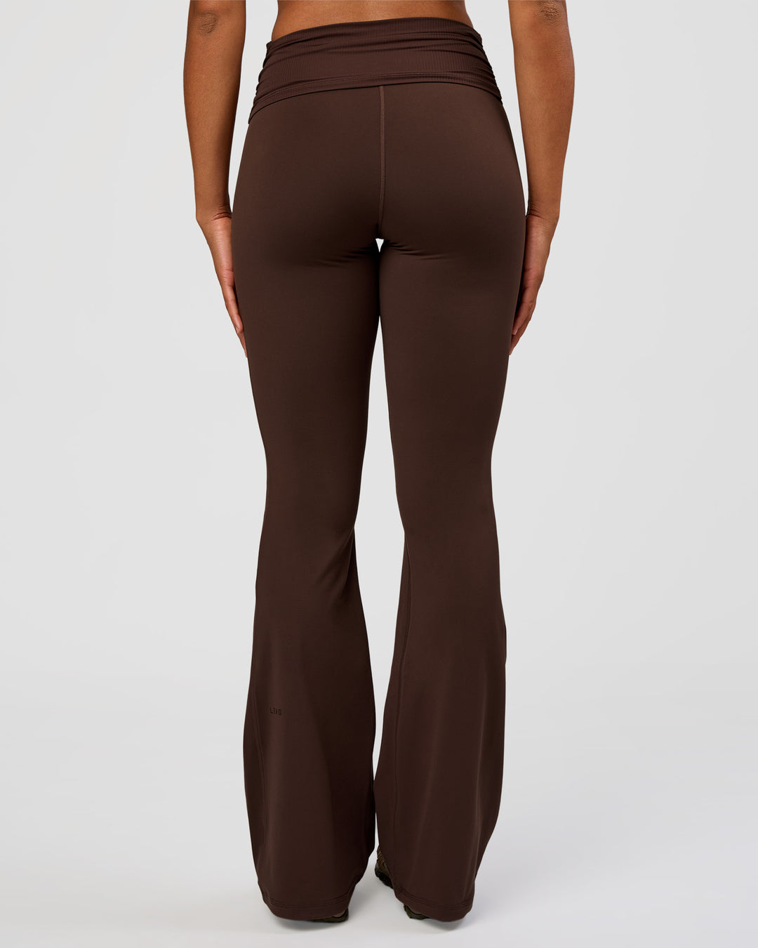 Woman wearing CF Fold Over High-Rise Flared Legging Tall - Hot Chocolate | Model:Rosie | Size:S