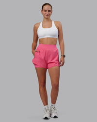 Woman wearing Challenger 3" Lined Performance Shorts in Pink Lemonade | Size:S