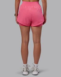 Woman wearing Challenger 3" Lined Performance Shorts in Pink Lemonade | Size:S