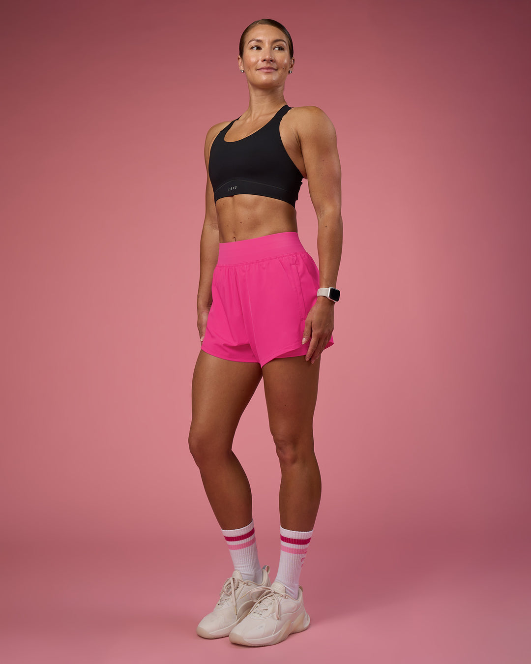 Woman wearing Challenger 3&quot; Lined Performance Short - Ultra Pink | Model:Hannah | Size:S