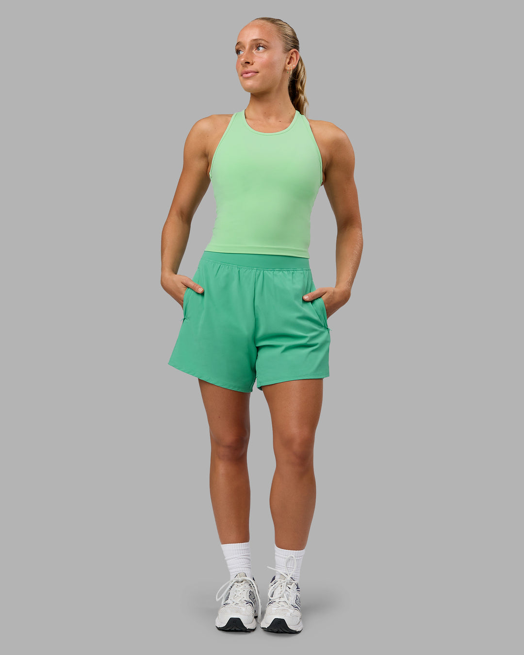 Woman wearing Challenger 5&quot; Lined Performance Shorts - Mystic Green