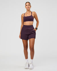 Woman wearing Challenger 5" Lined Performance Short - Midnight Plum | Model:Rhiley | Size:S