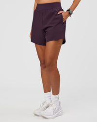 Woman wearing Challenger 5" Lined Performance Short - Midnight Plum | Model:Rhiley | Size:S