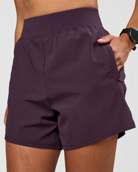 Woman wearing Challenger 5" Lined Performance Short - Midnight Plum | Model:Rhiley | Size:S