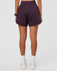 Woman wearing Challenger 5" Lined Performance Short - Midnight Plum | Model:Rhiley | Size:S