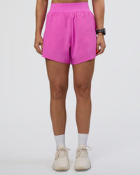 Woman wearing Challenger 5" Lined Performance Short - Ultra Fuchsia | Model:Abbey | Size:S
