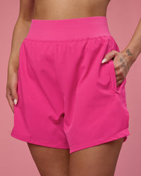 Woman wearing Challenger 5" Lined Performance Short - Ultra Pink | Model:Tianah | Size:S