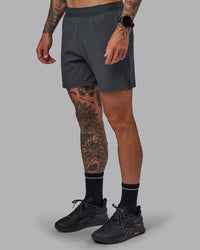 Man wearing Challenger 6" Performance Short in Dark Storm | Size:S