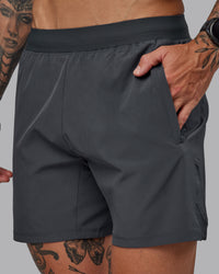 Man wearing Challenger 6" Performance Short in Dark Storm | Size:S