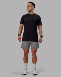 Man wearing Challenger 6" Performance Shorts - Storm Front