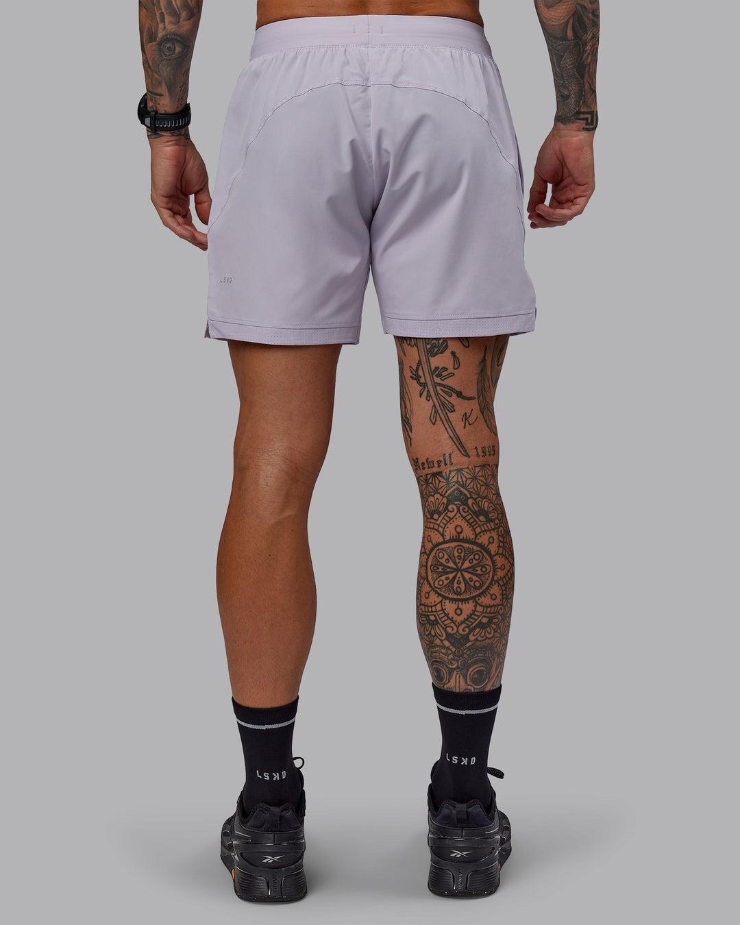 Man wearing Challenger 6&quot; Performance Short in Galactic Lilac | Size:S