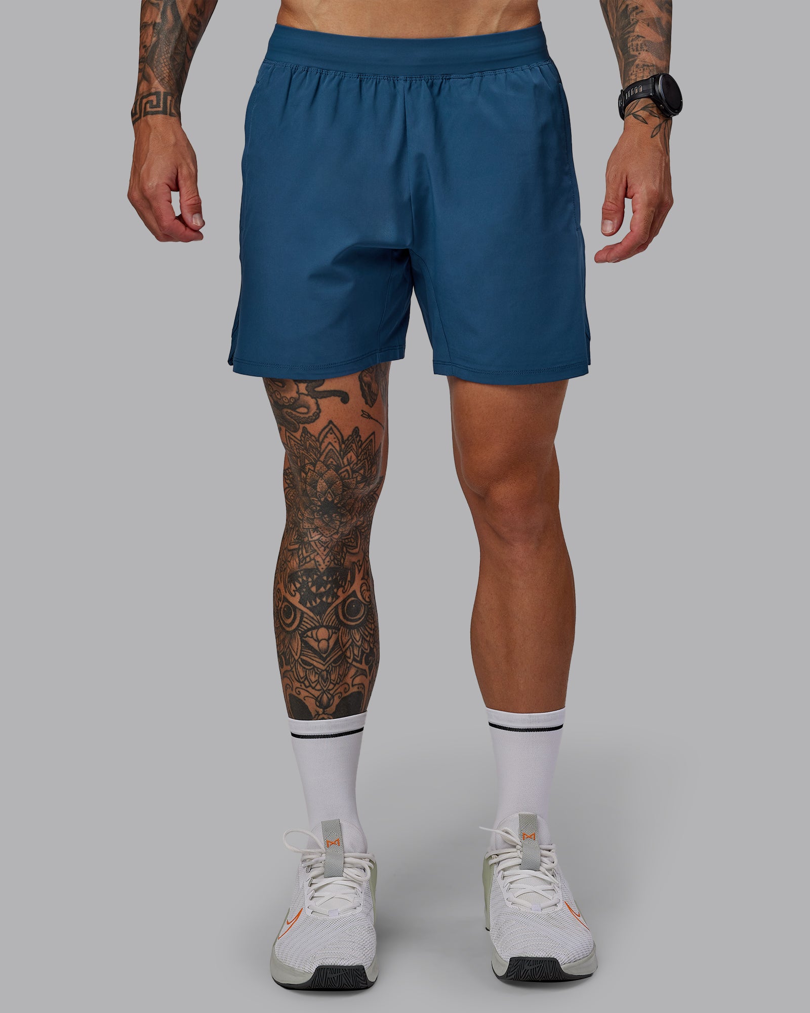 Man wearing Challenger 6" Performance Short in Indigo | Size:S