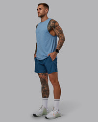 Man wearing Challenger 6" Performance Short in Indigo | Size:S