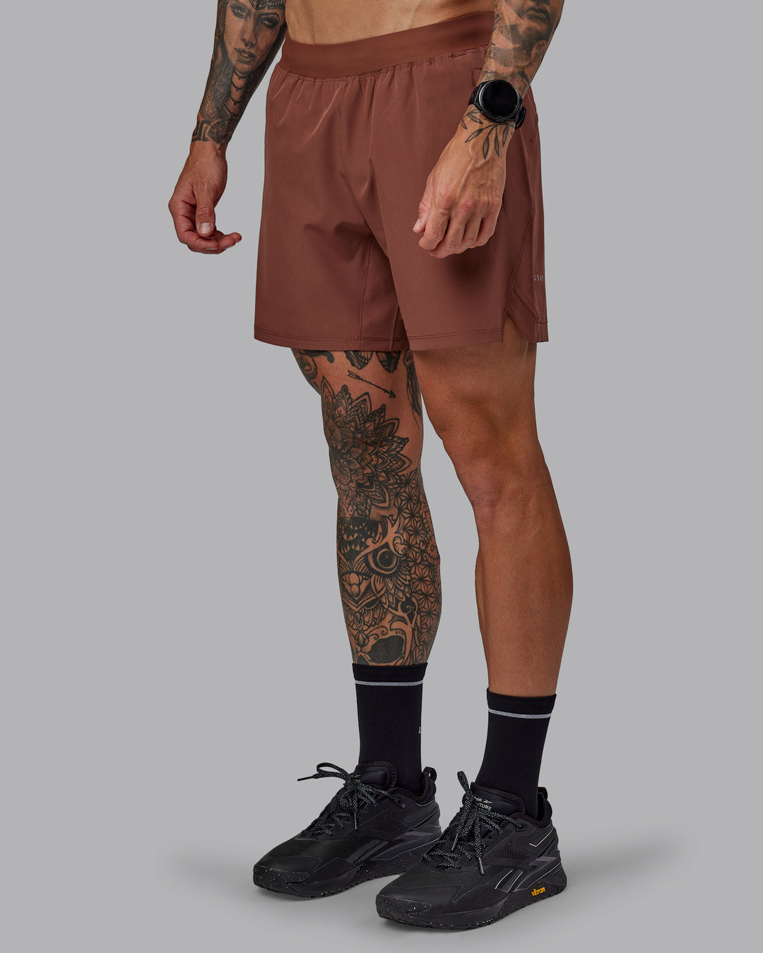 Man wearing Challenger 6&quot; Performance Short in Mahogany | Size:S