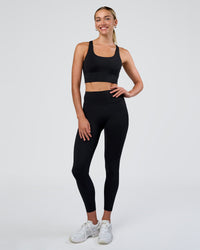 Woman wearing Circuit Longline Sports Bra - Black | Model:Evie | Size:S | Thumbnail Index: 2