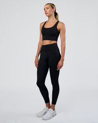 Woman wearing Circuit Longline Sports Bra - Black | Model:Evie | Size:S | Thumbnail Index: 4