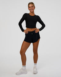 Woman wearing Clarity Long Sleeve Tee - Black | Model:Amity | Size:S