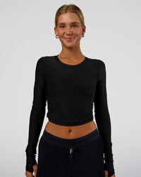 Woman wearing Clarity Long Sleeve Tee - Black | Model:Amity | Size:S