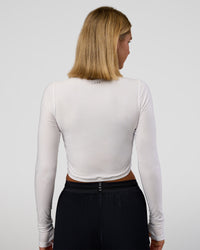 Woman wearing Clarity Long Sleeve Tee - White | Model:Amity | Size:S