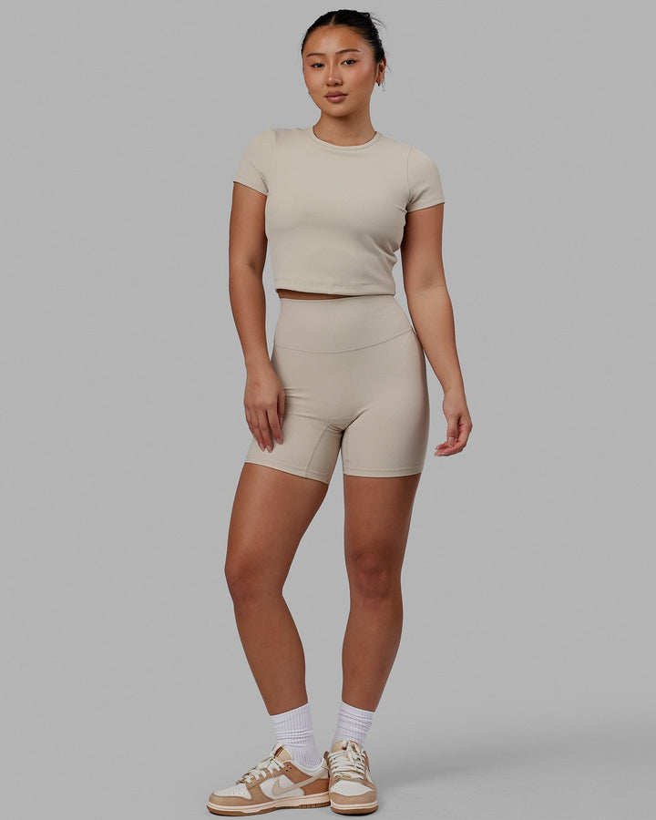 Woman wearing Creator Ribbed Mid Short Tights - Shale Beige