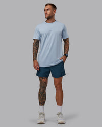 Man wearing Daily 5" Shorts - Indigo