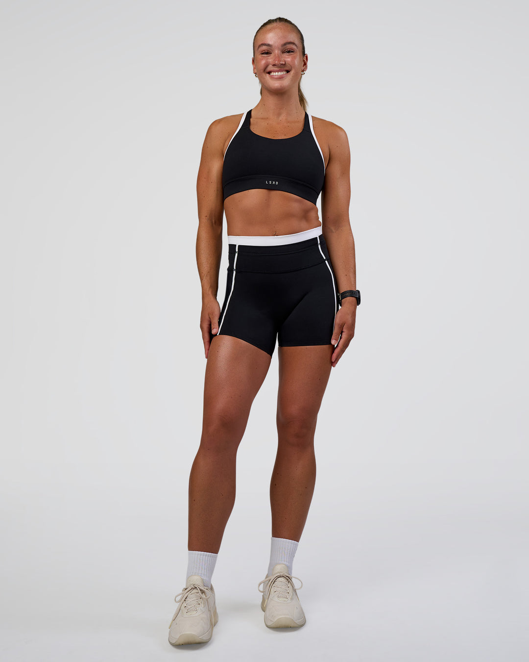 Woman wearing Distinction Sports Bra 2.0 - Black-White | Model:Sav | Size:S