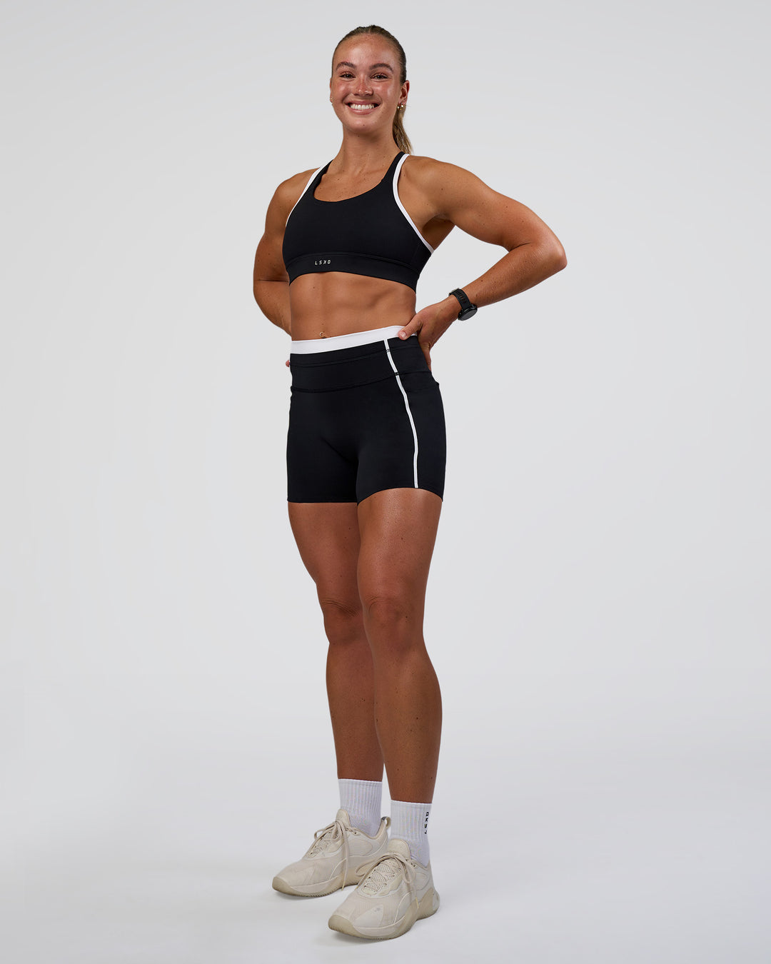 Woman wearing Distinction Sports Bra 2.0 - Black-White | Model:Sav | Size:S