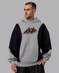 Man wearing Downtown Oversized Panel Hoodie - Circular Grey - Black | Model:Tommy | Size:S