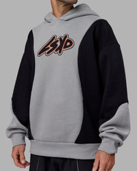 Man wearing Downtown Oversized Panel Hoodie - Circular Grey - Black | Model:Tommy | Size:S