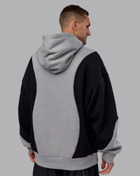 Man wearing Downtown Oversized Panel Hoodie - Circular Grey - Black | Model:Tommy | Size:S