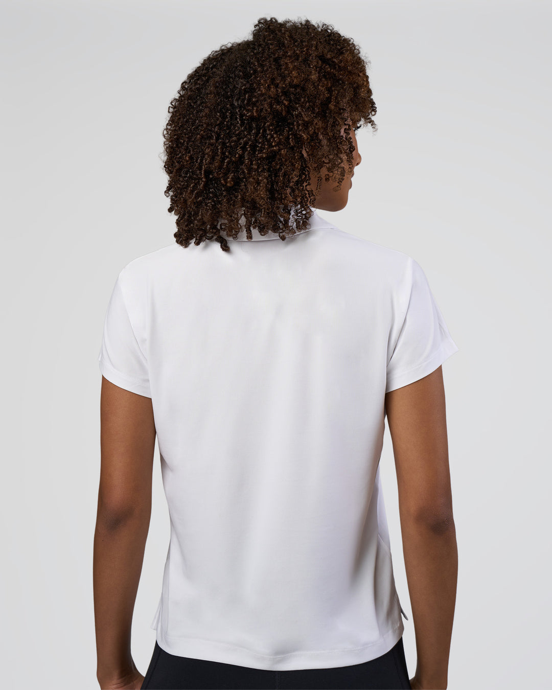 Woman wearing Drive Polo - White | Model:Tomi | Size:S