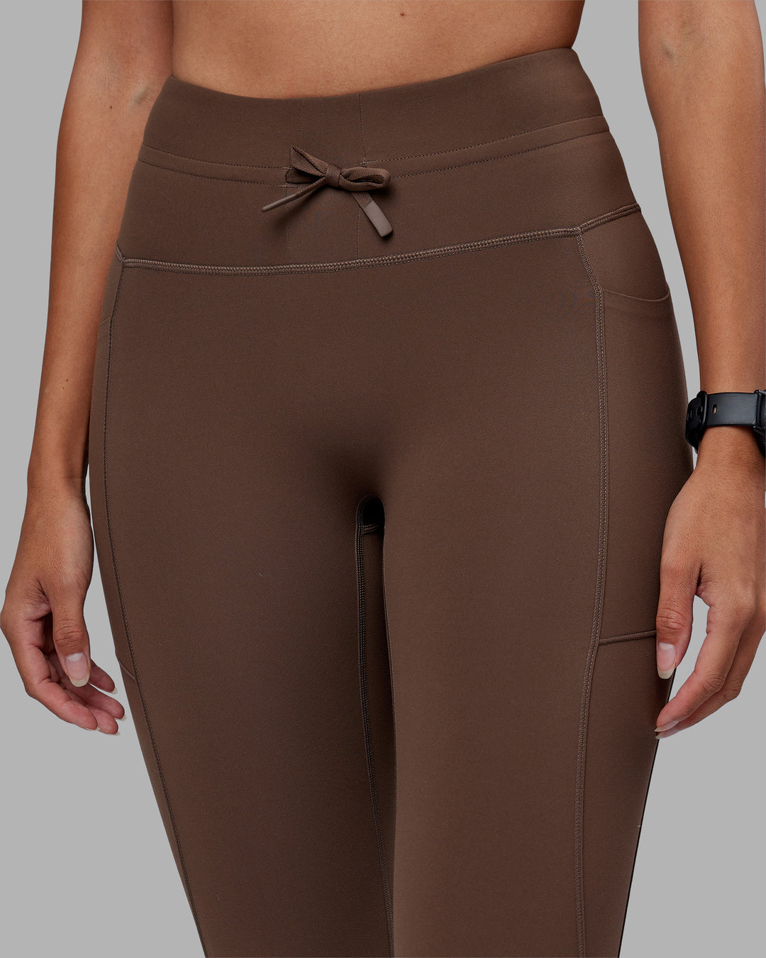 Woman wearing Effortless Drawstring Ultra High-Rise Full Length Legging Pockets - Chocolate Martini | Model:Rhiley | Size:S