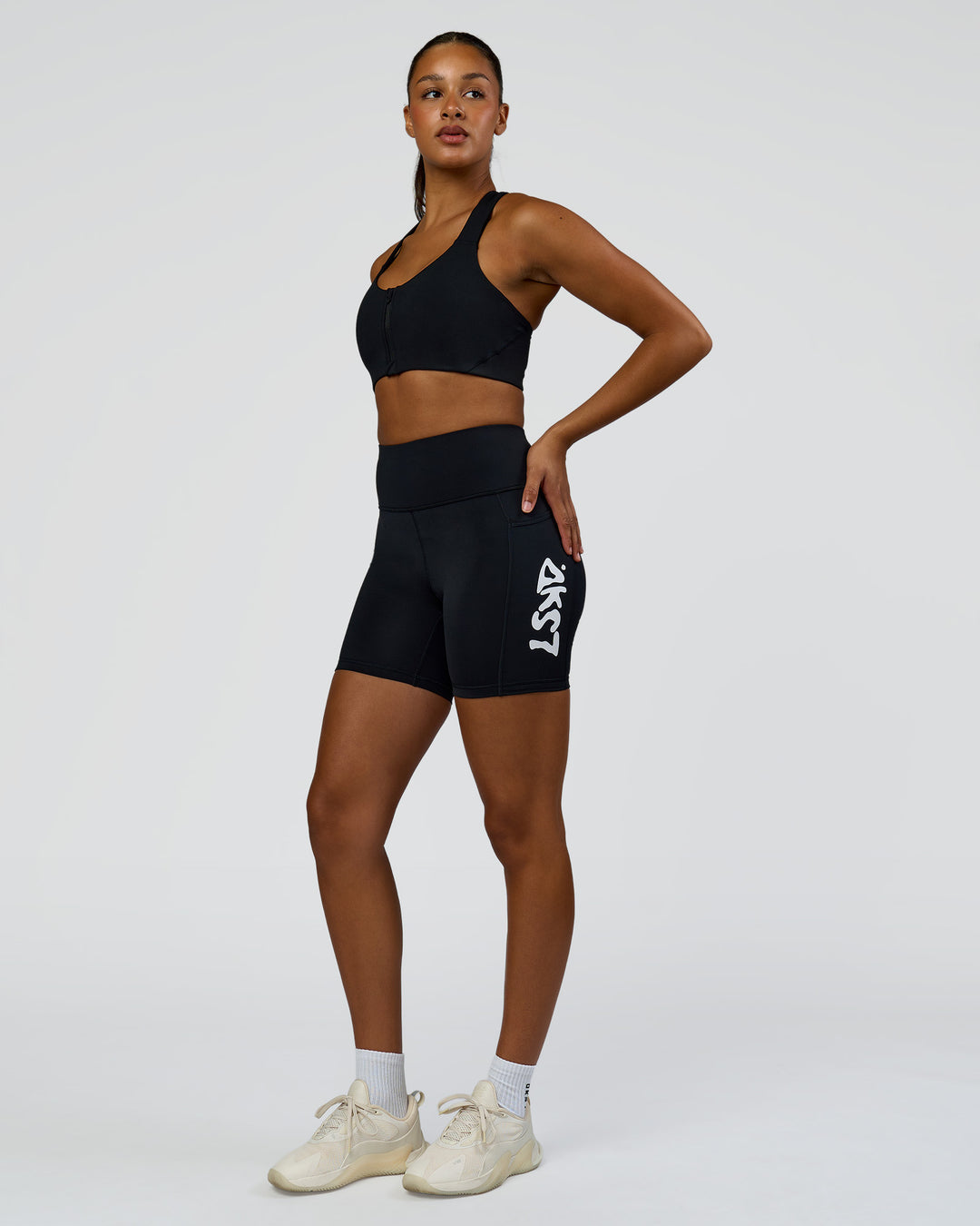 Woman wearing Elarra Zip Front Sports Bra - Black | Model:Rosie | Size:S