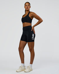 Woman wearing Elarra Zip Front Sports Bra - Black | Model:Rosie | Size:S