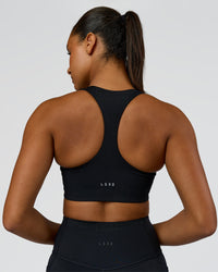 Woman wearing Elarra Zip Front Sports Bra - Black | Model:Rosie | Size:S