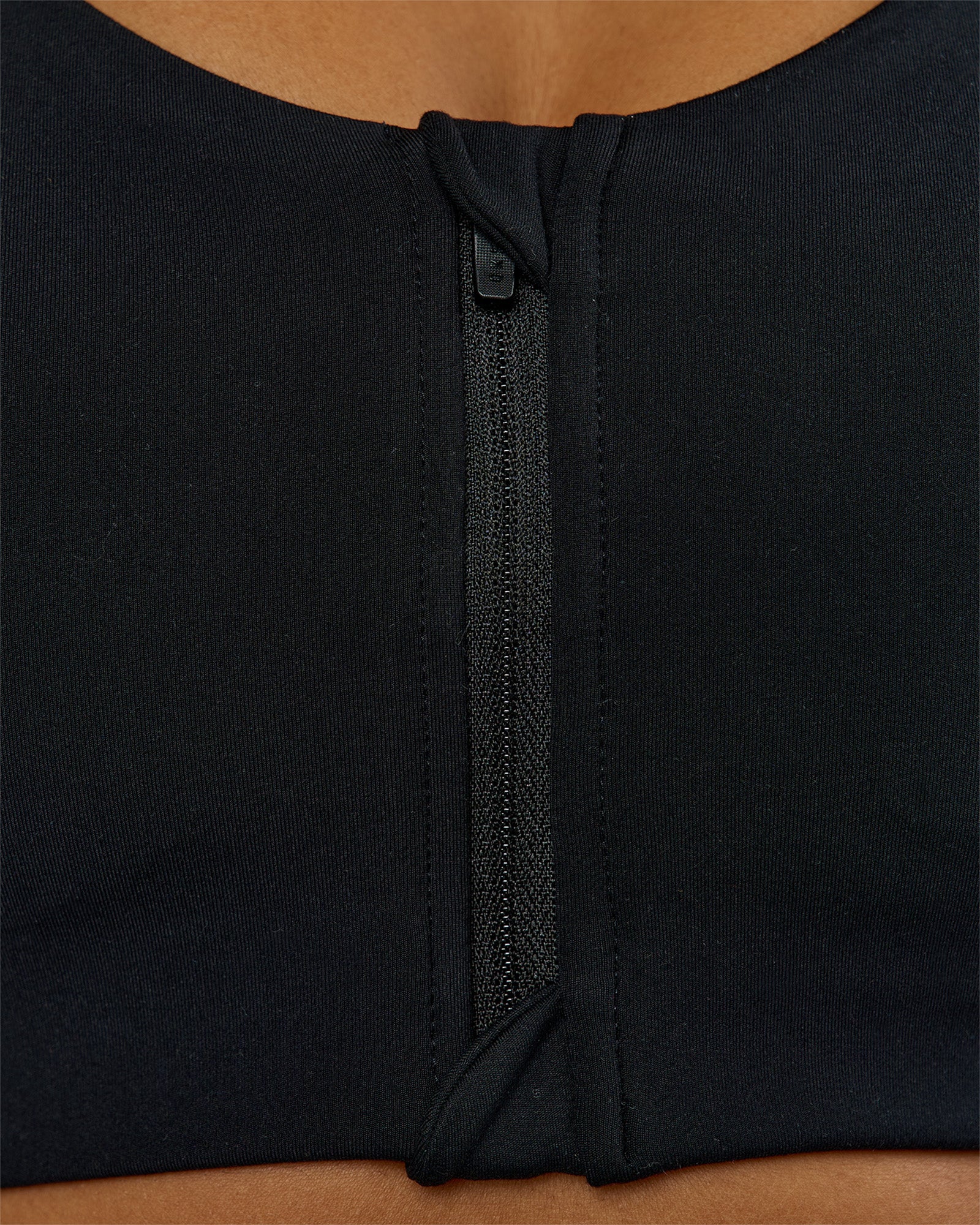Woman wearing Elarra Zip Front Sports Bra - Black | Model:Rosie | Size:S