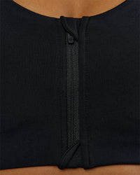 Woman wearing Elarra Zip Front Sports Bra - Black | Model:Rosie | Size:S